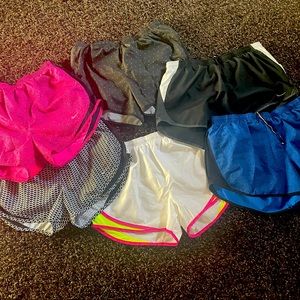 NIKE WOMEN RUNNING SHORTS..SET OF 6. Size Medium.  EXCELLENT CONDITION